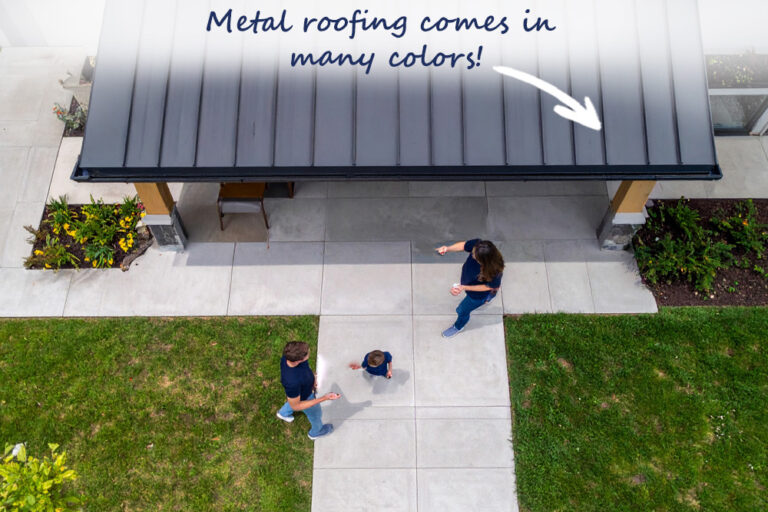 Family playing in yard metal roof house.