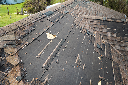Loose-storm-damaged-shingles